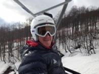 Adaptive ski racer Corey Peters wears a helmet when skiing