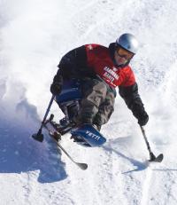 An adaptive skier using a monoski